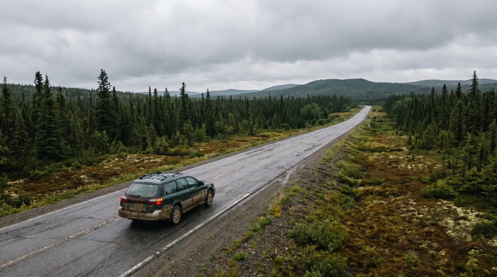 Rental car on the Trans-Canada Highway through boreal forest in central Newfoundland